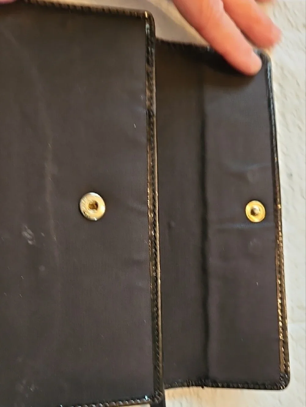 kate spade black wallet with gold-tone nameplate